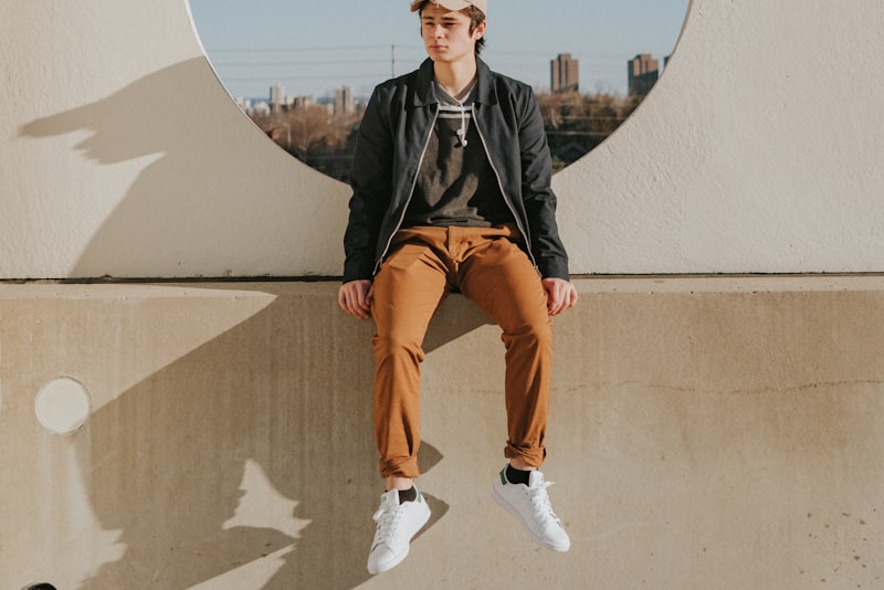 A relaxed portrait of a person near a window, lit by soft daylight